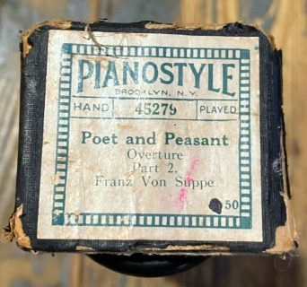 End of the player piano roll box with the title of the song