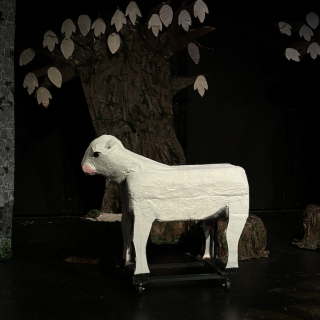 Full body shot of Milky-White on stage.