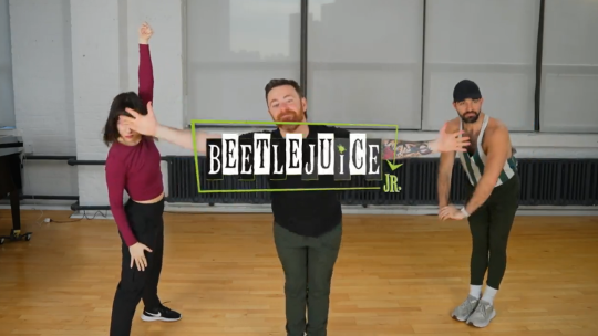 Three dancers posing with the Beetlejuice JR logo