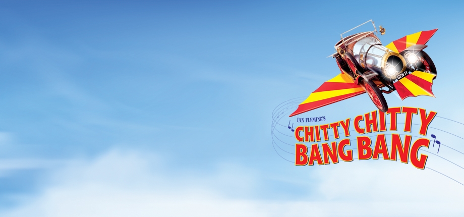 blue sky with clouds featuring a chitty chitty bang bang logo (flying car with yellow and red wings)