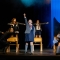 Cast members singing Revolting Children